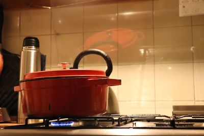 Close-up of utensil on stove in kitchen at home