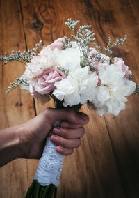 Close-up of woman holding bouquet