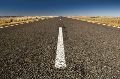 Road amidst landscape against sky