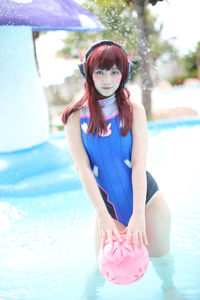 Young woman swimming in pool