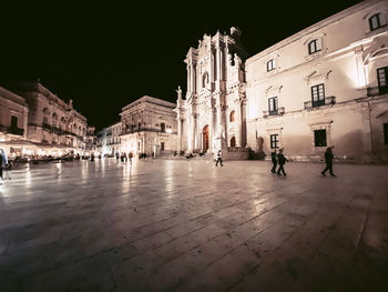 Buildings in city at night