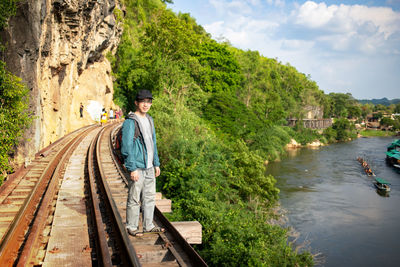 Man standing on railroad track