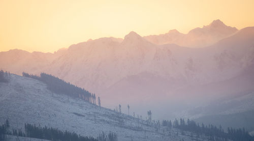 Colorful winter sunrise above mountain range, slovakia, europe