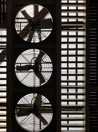 Close-up of clock on window in building