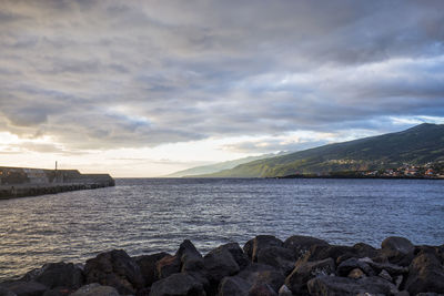 Scenic view of sea against sky at sunset