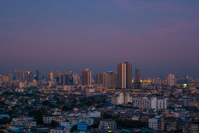 Aerial view of modern buildings in city against sky