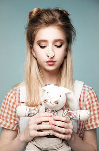 Portrait of a beautiful young woman over white background