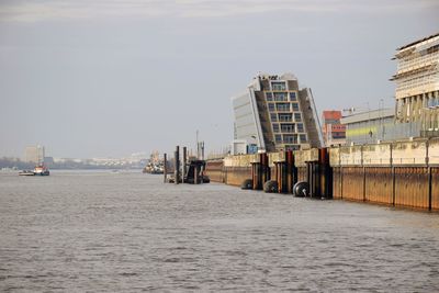 Panoramic view of beach and buildings against sky