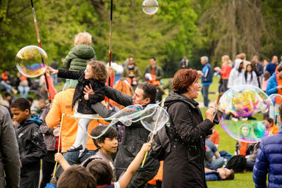 Group of people enjoying on the ground