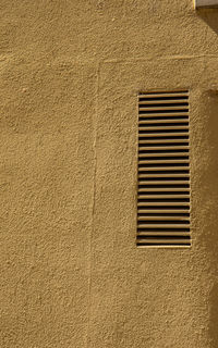 Low angle view of window on building wall