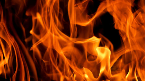 Close-up of fire burning at night