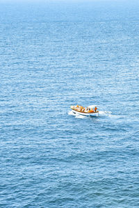 High angle view of boat sailing in sea