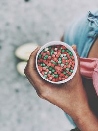 High angle view of woman holding ice cream