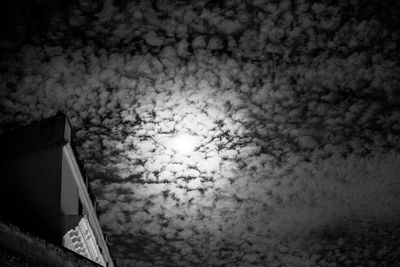 Low angle view of building against cloudy sky