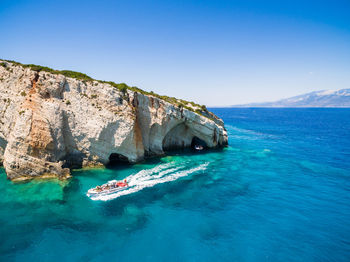 Scenic view of sea against clear blue sky