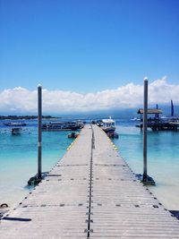 Pier over sea against sky