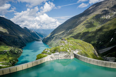 High angle view of dam by swimming pool against sky