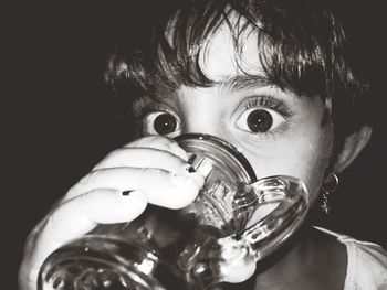 Close-up portrait of girl having drink