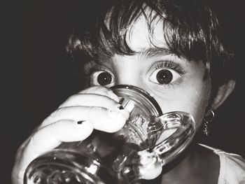 Close-up portrait of girl having drink