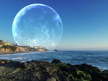 Scenic view of sea against blue sky