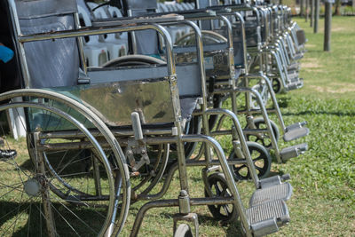 Bicycles parked in row on field