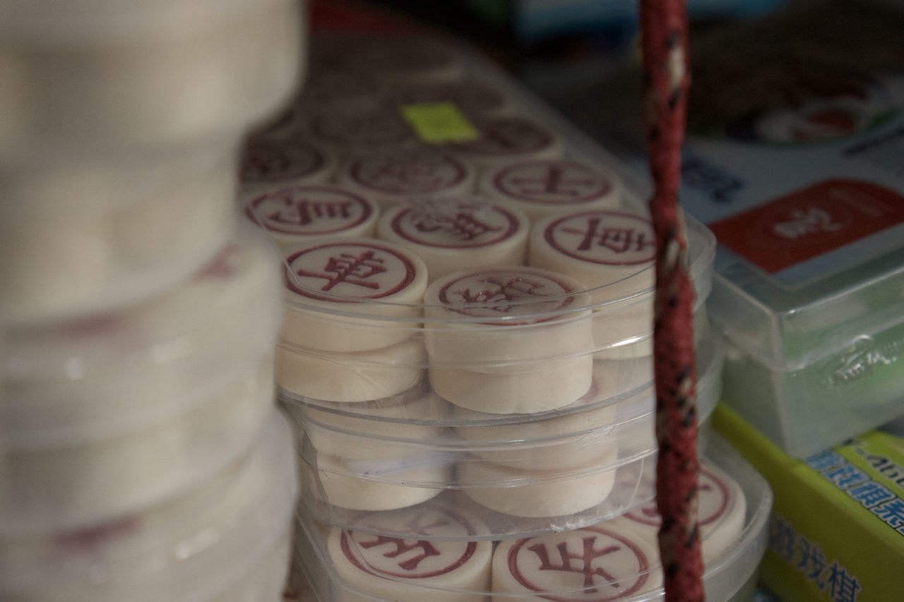 food, dairy, no people, indoors, dessert, finance, close-up, business, retail, icing, large group of objects, food and drink, container, in a row, still life