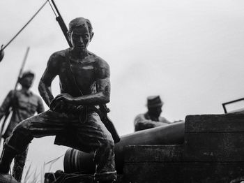 Low angle view of statue against sky