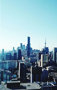 Skyscrapers in city against clear sky