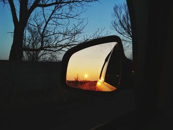 Silhouette of car at sunset