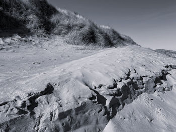 Scenic view of snow covered land