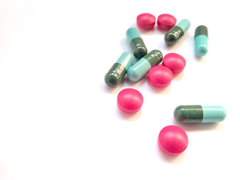 Close-up of multi colored pencils over white background