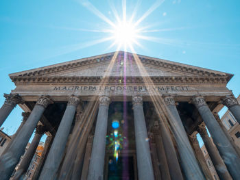 Low angle view of historical building against blue sky