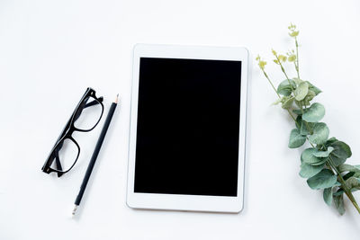 Telephone booth on table against white background