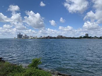 Panoramic view of sea and buildings against sky