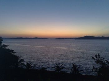 Scenic view of sea against clear sky during sunset