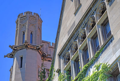 Low angle view of building against clear blue sky