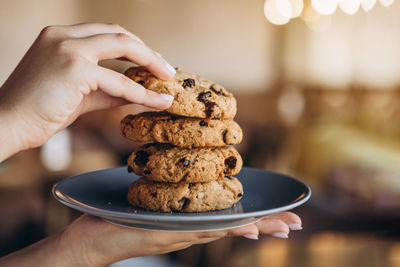 Close-up of hand holding dessert