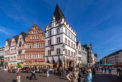 Group of people in front of buildings in town