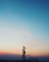 Silhouette of statue against cloudy sky