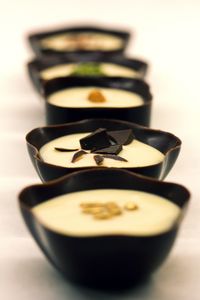 Close-up of tea cup on table against white background