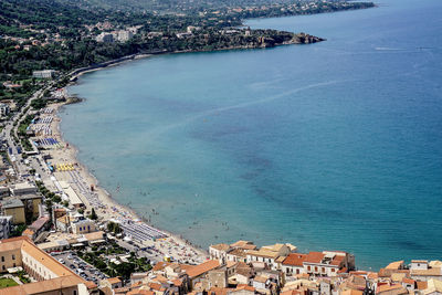 High angle view of townscape by sea