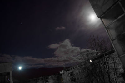 Low angle view of illuminated street light against sky at night