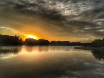 Scenic view of lake against sky during sunset