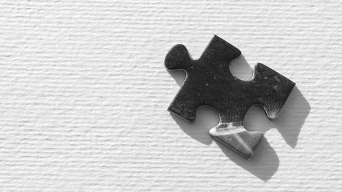 Close-up of puzzle piece on table