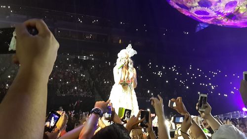 People enjoying at concert