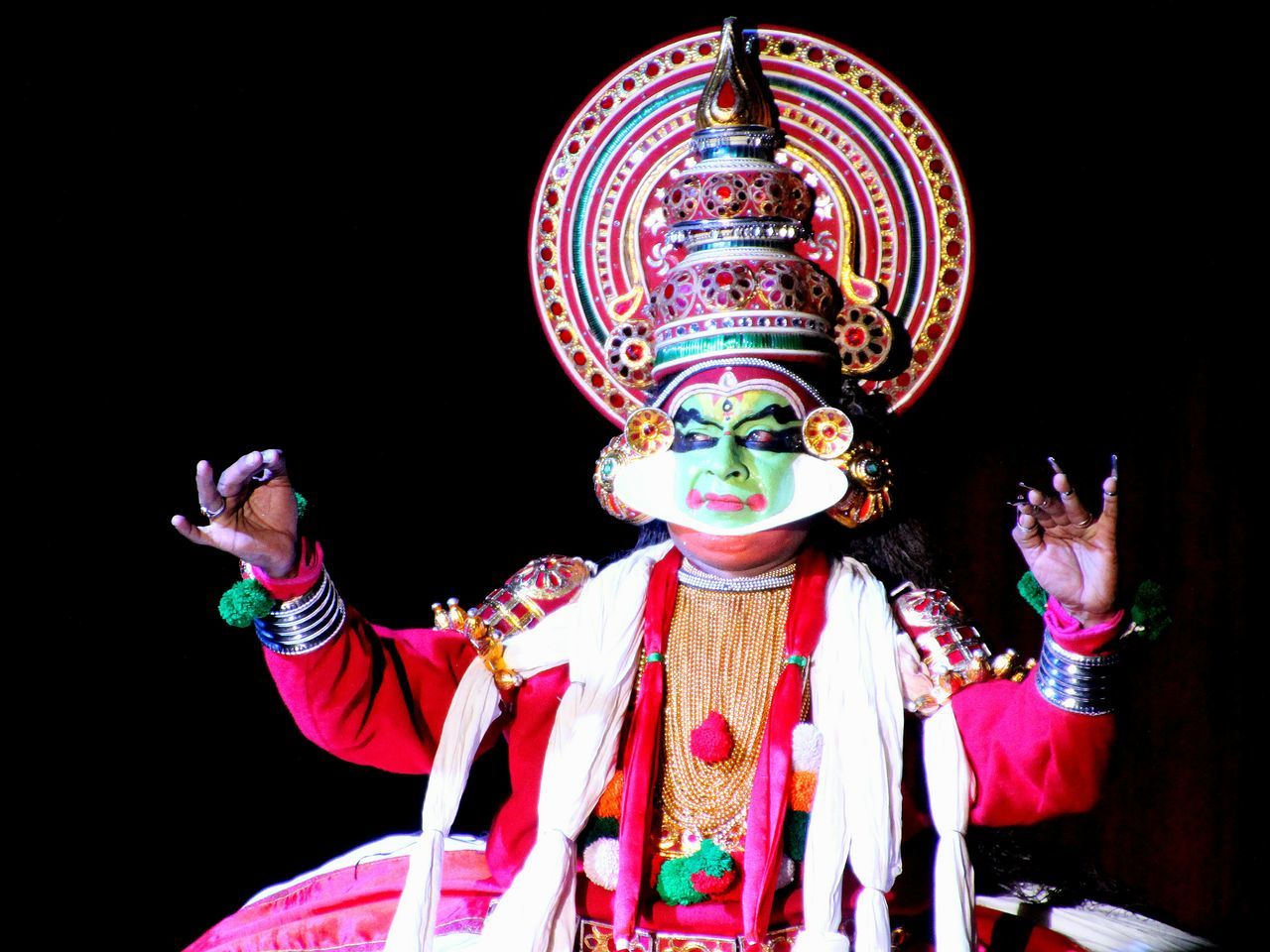 MIDSECTION OF MAN HOLDING TRADITIONAL CLOTHING