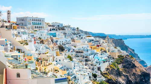 High angle view of townscape by sea against sky