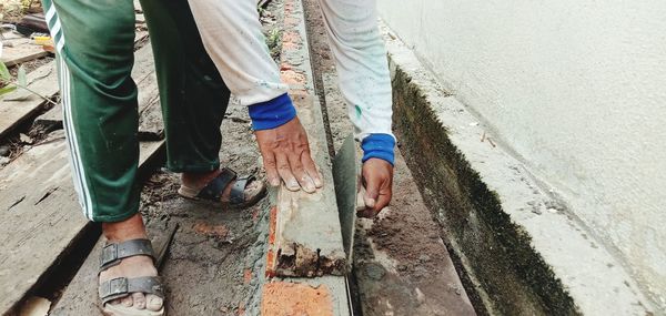 A builder working on a brick wall