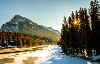 Scenic view of snow covered mountains against sky