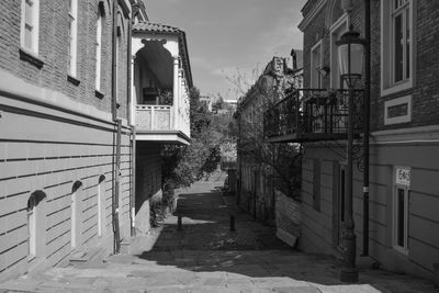 Street amidst buildings against sky